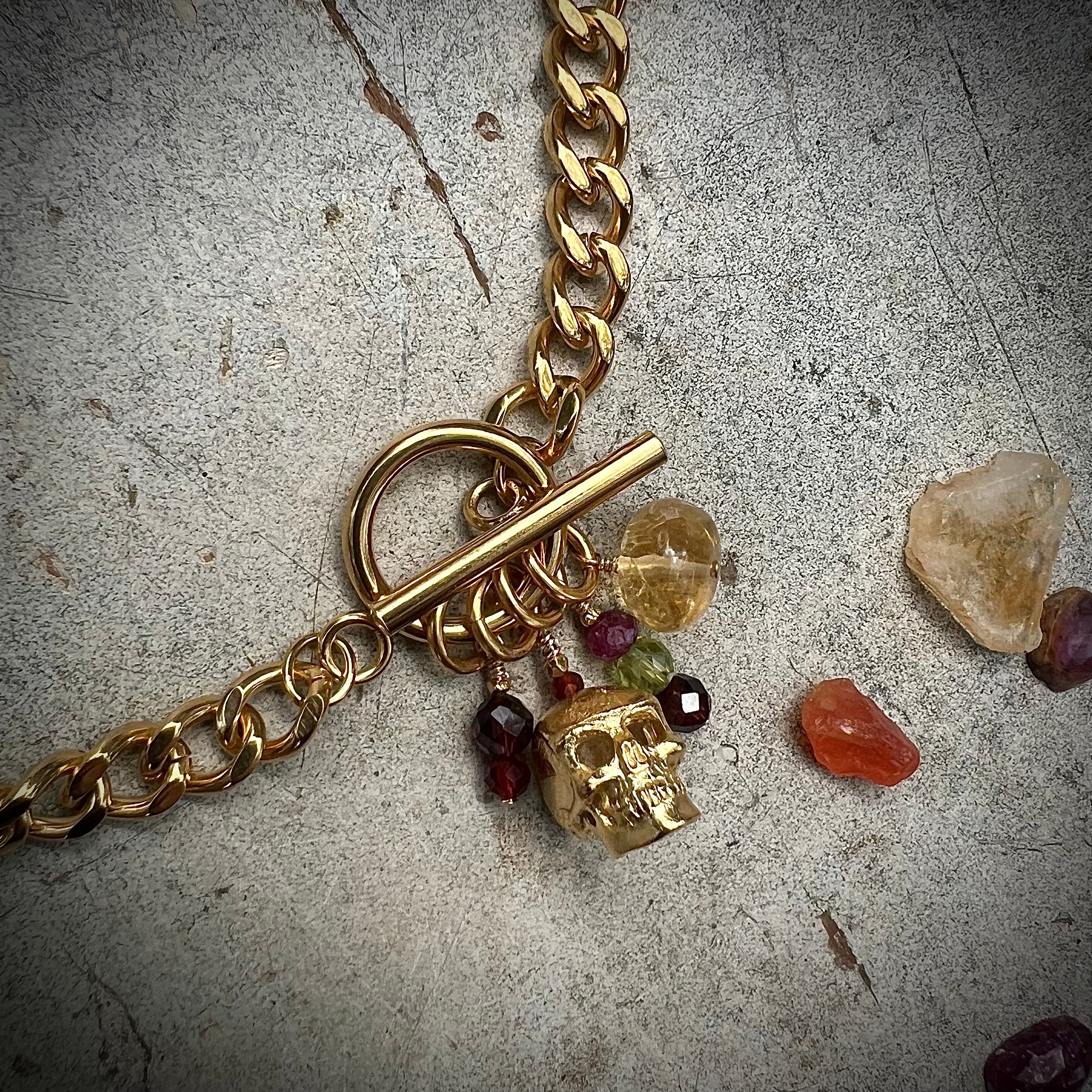 Skull and Stones on gold chain